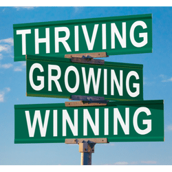 Thriving, Growing, Winning street sign